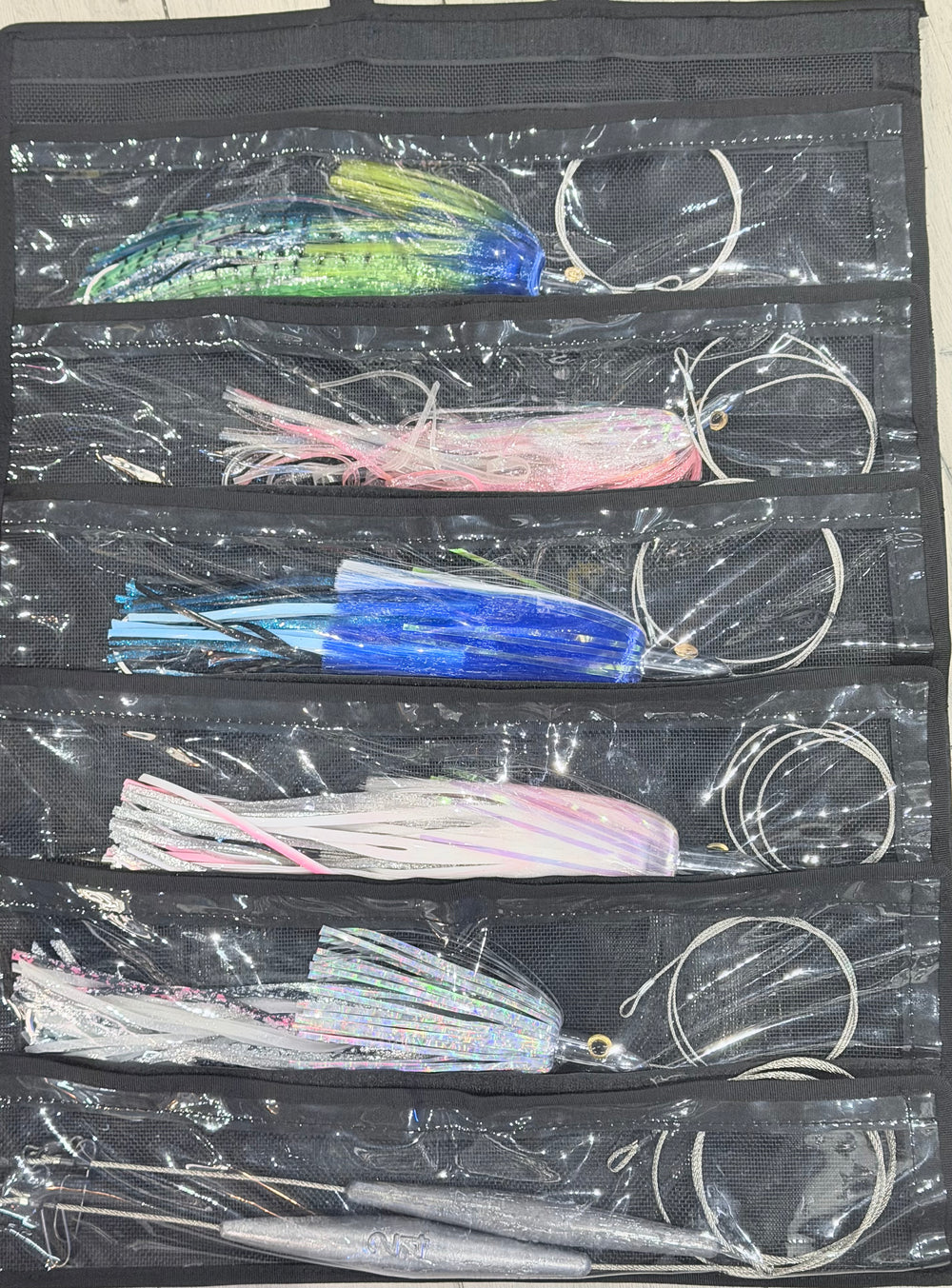 Custom Wahoo Trolling Lure Pack - 6 Pocket Kit showing 5 Islander lures rigged and organized in black pocket lure bag