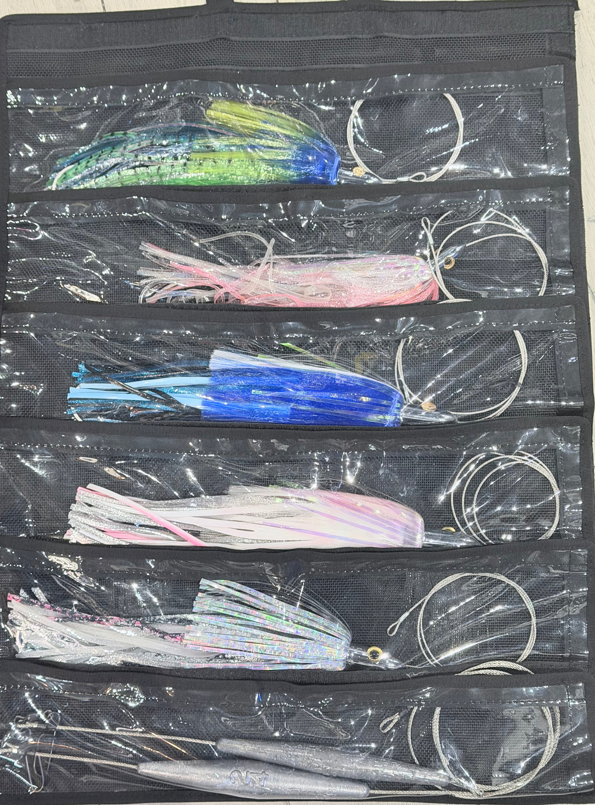 Custom Wahoo Trolling Lure Pack - 6 Pocket Kit showing 5 Islander lures rigged and organized in black pocket lure bag