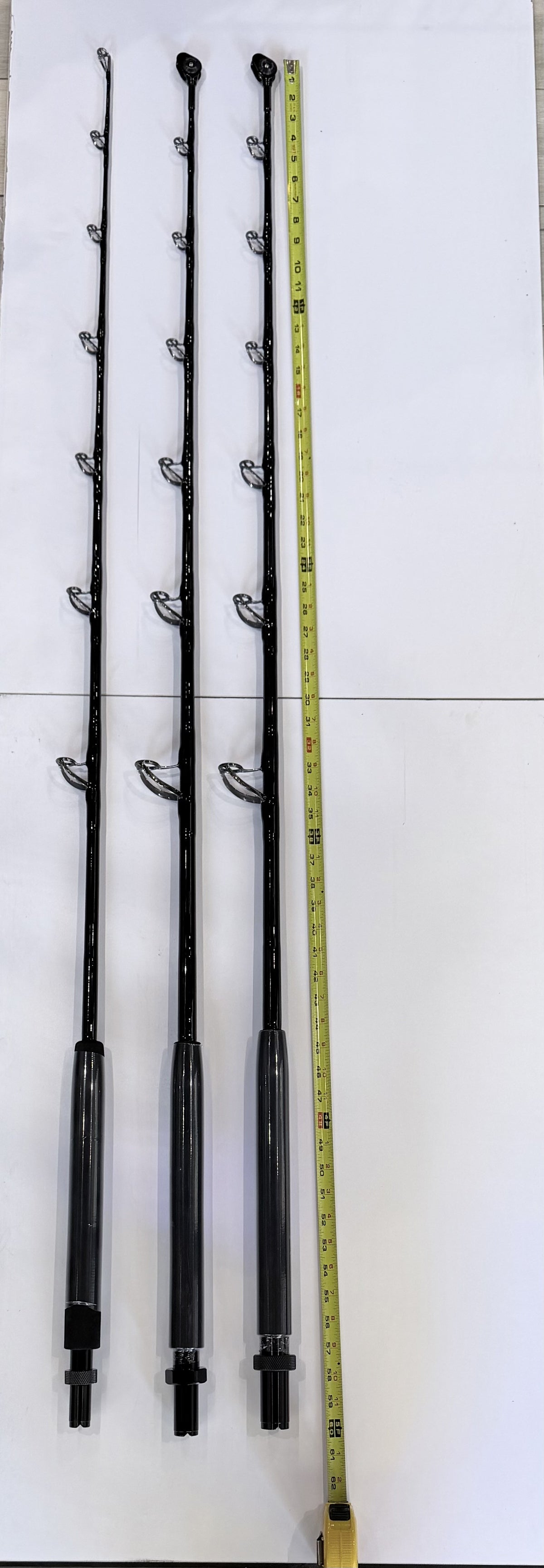 SaltH2O all-black custom trolling rods in 30, 50 and 80 lb with Fuji SiC guides and Winthrop roller tips